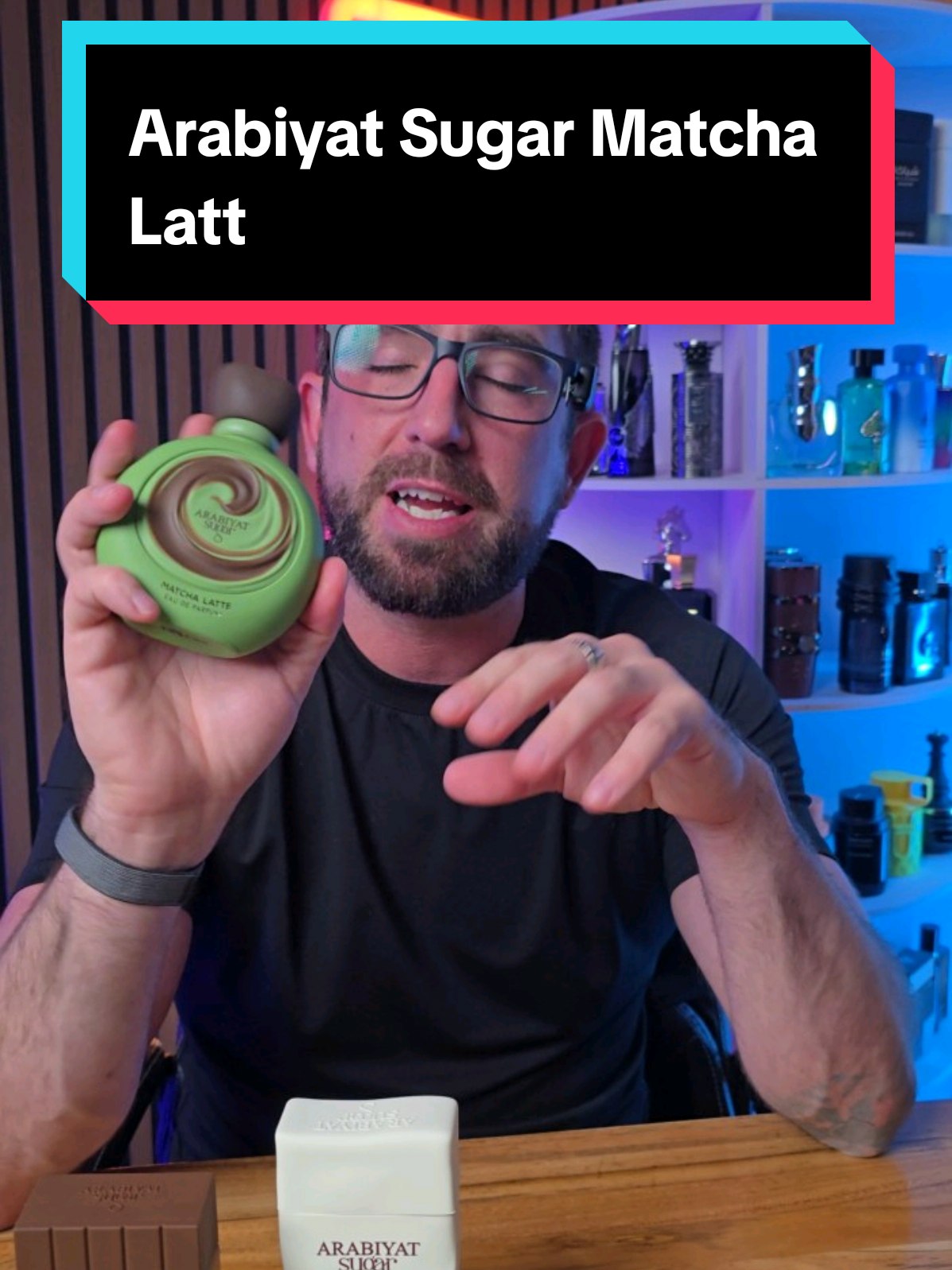 Loren Noble holding a green Arabiyat Sugar Matcha Latte fragrance bottle