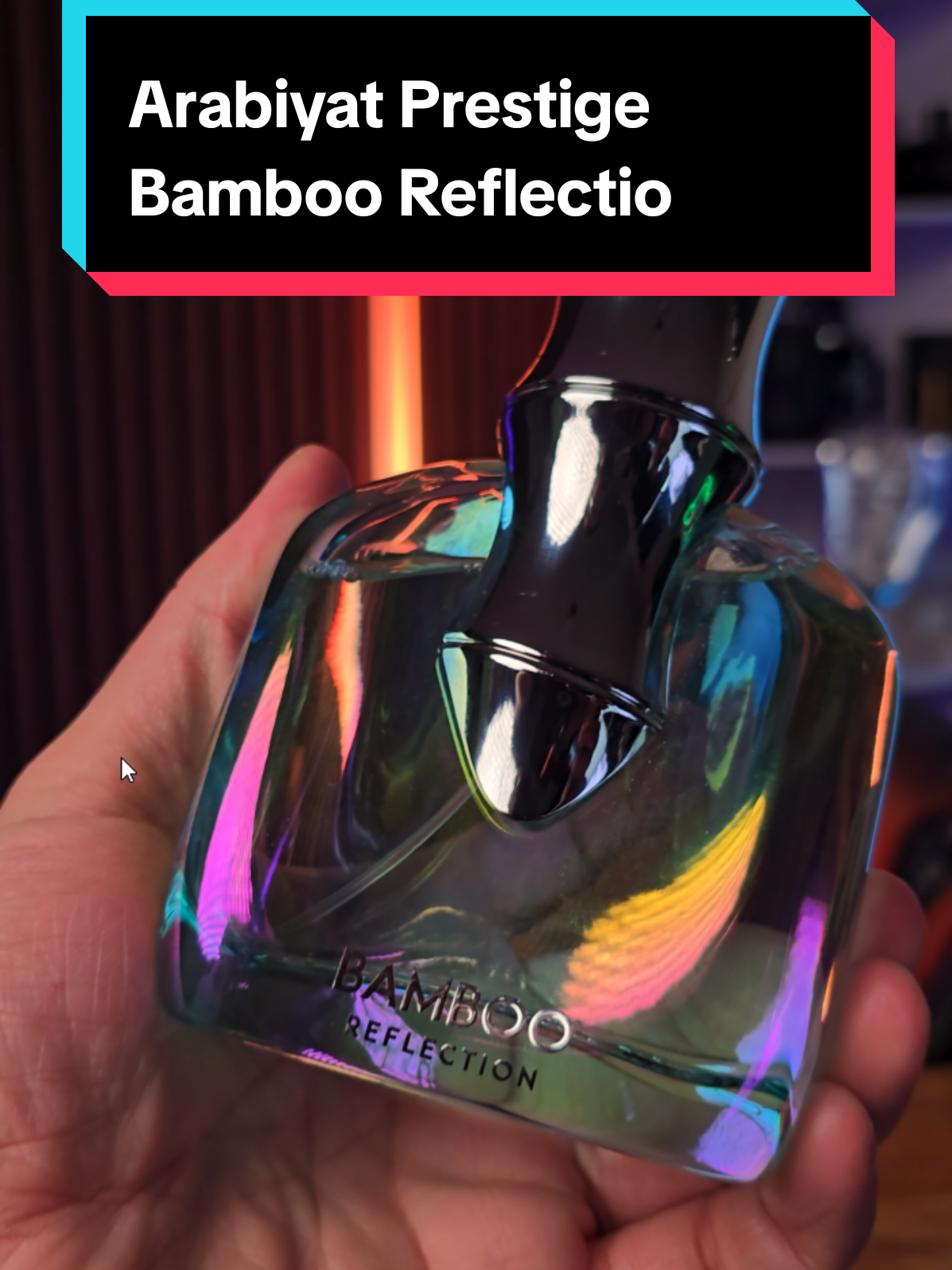 Arabiyat Prestige Bamboo Reflection fragrance bottle held close to the camera